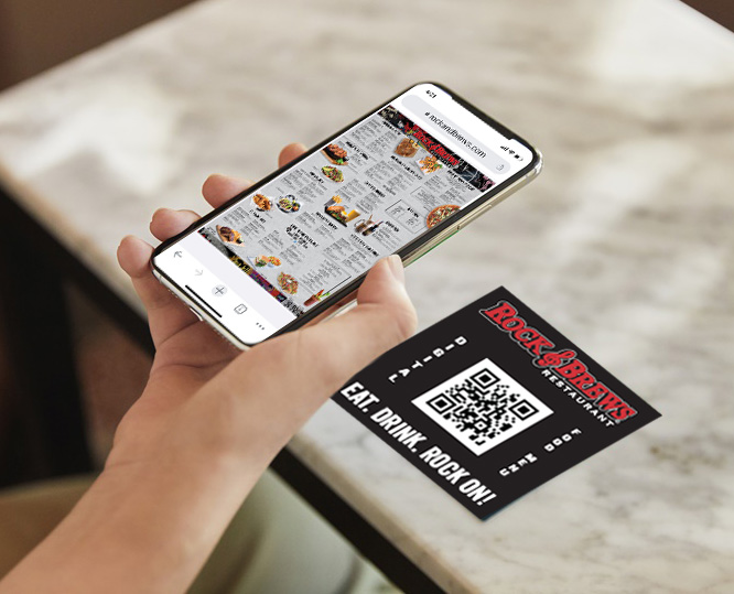 Phone scanning a QR code to access the Rock & Brews menu