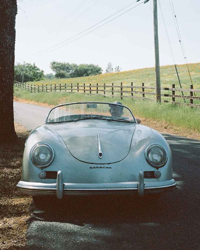 Man driving an old Porsche